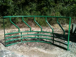 Green steel round bale feeder